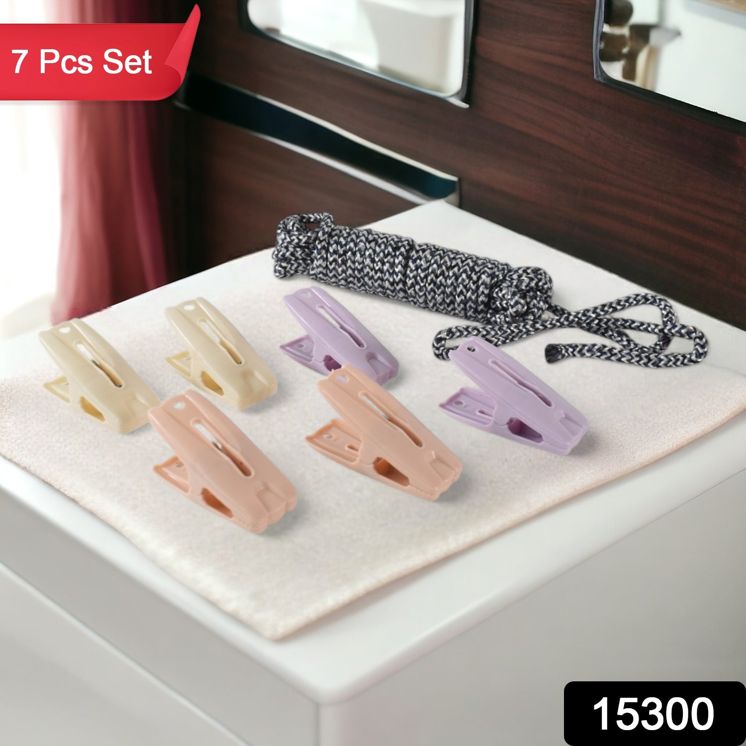 Strong plastic clips securely holding clothes on drying rope