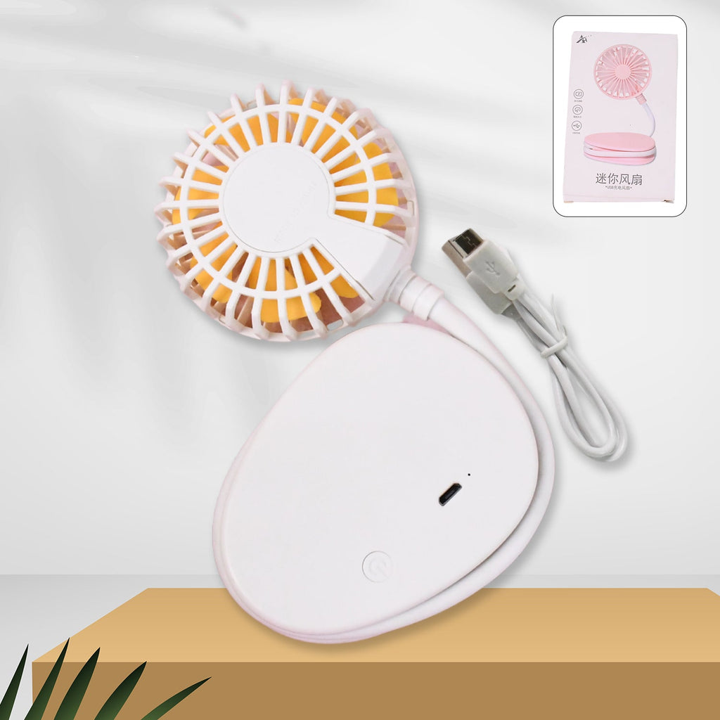 Mini USB Fan providing cooling breeze on office desk