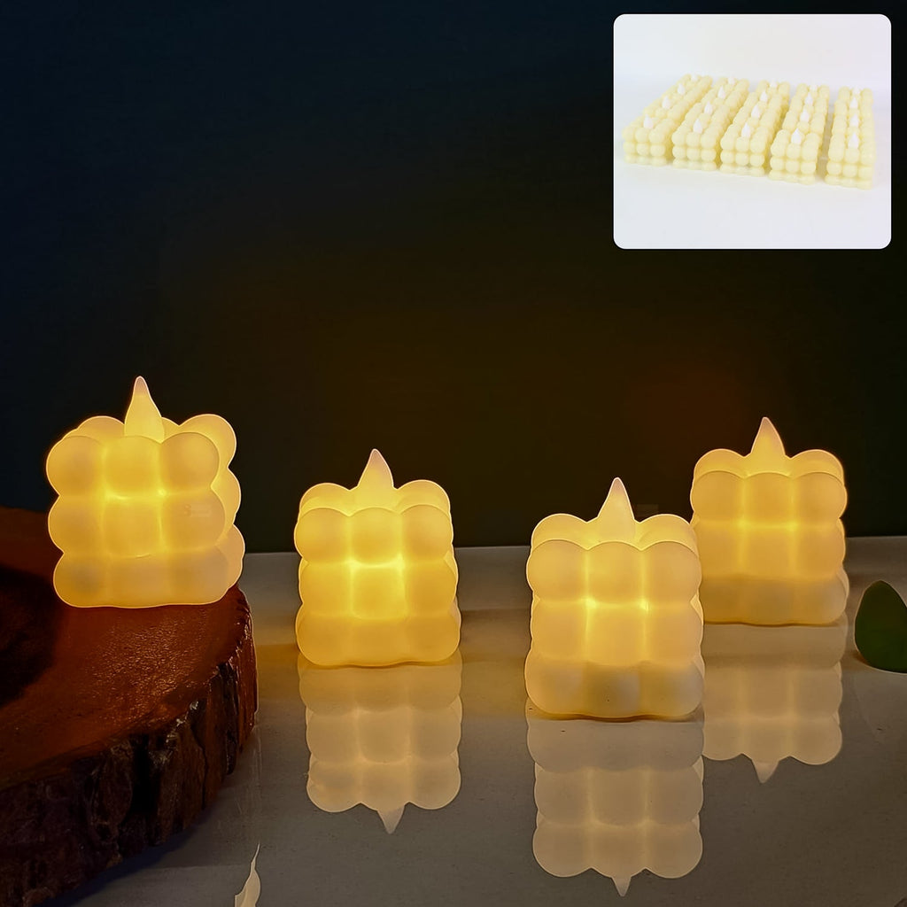 Set of 24 LED flameless cube candles glowing with warm light for elegant home decor