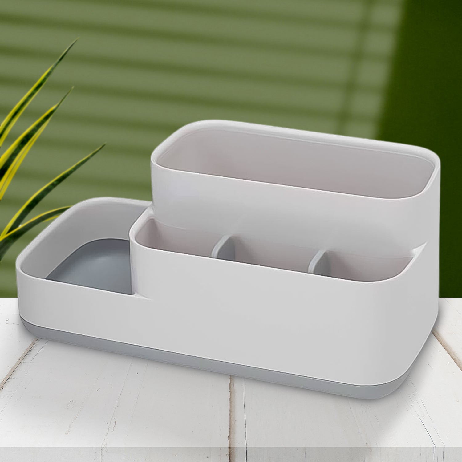 Plastic 5-compartment bathroom desk organizer holding various items.