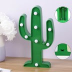 Vibrant green LED Cactus Lamp glowing brightly on a table.