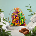 Mesh fabric potli bag with shimmering drawstring closure holding premium chocolates