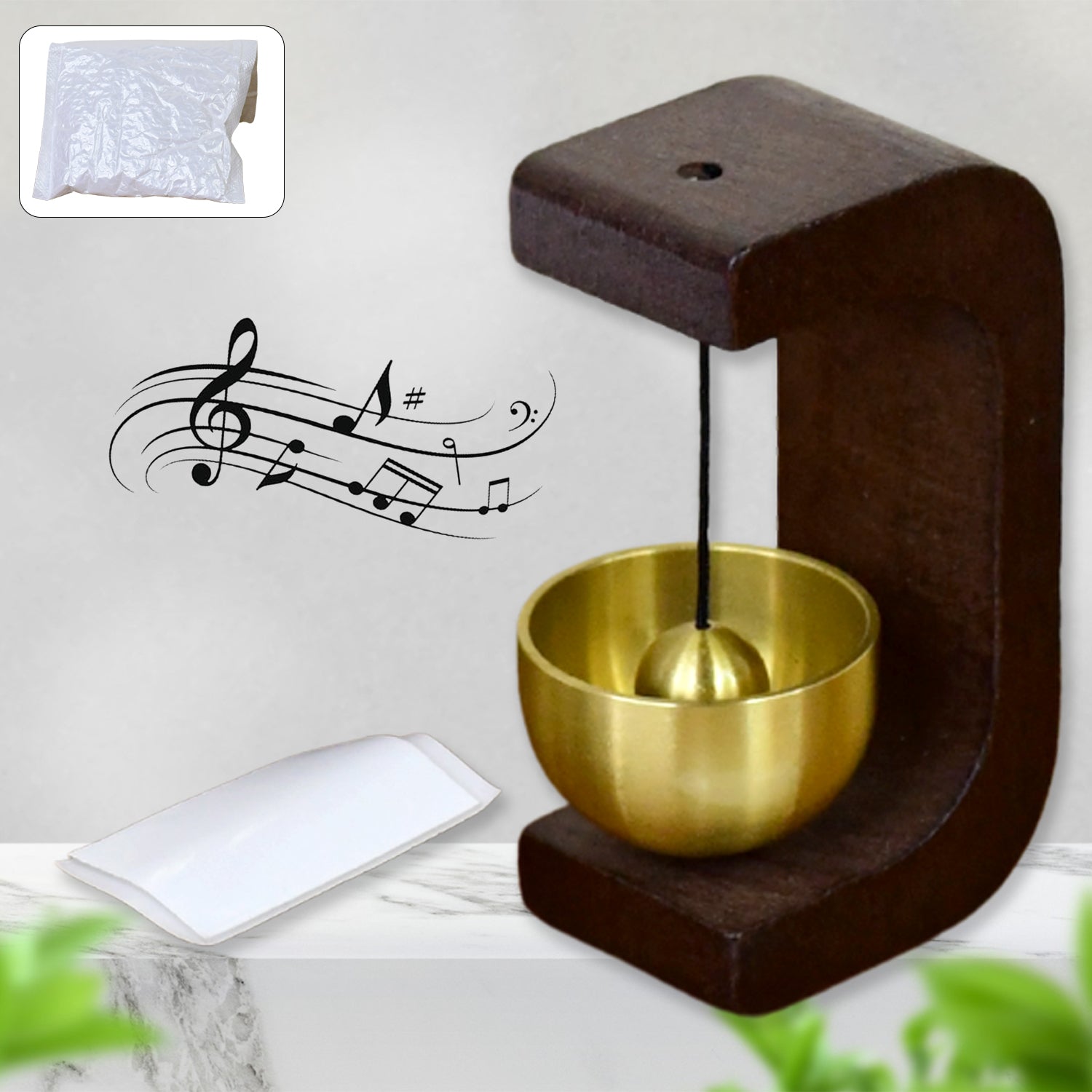 Japanese Style Zen Bell with wooden stand and brass chime ball on desktop