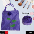 Two views of the eco-friendly foldable shopping bag, one folded into a rose and one fully open.