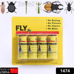 Fly catcher sticky strips effectively trapping pests in a garden setting.