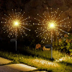Decorative solar firework LED garden lights illuminating outdoor space