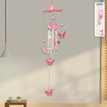 Butterfly Bell Wind Chime hanging outdoors with colourful butterfly design