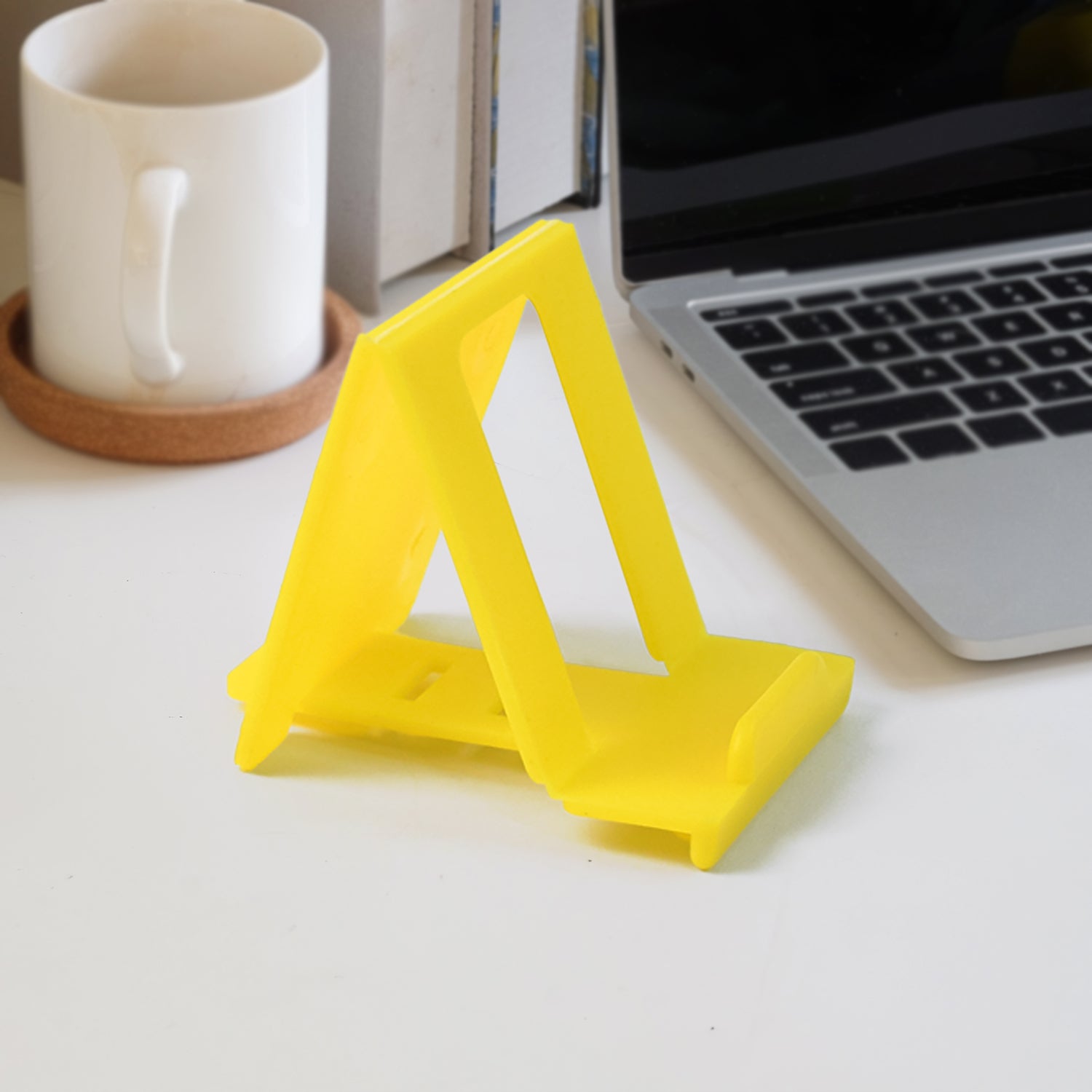 Adjustable foldable plastic mobile phone stand holding phone securely