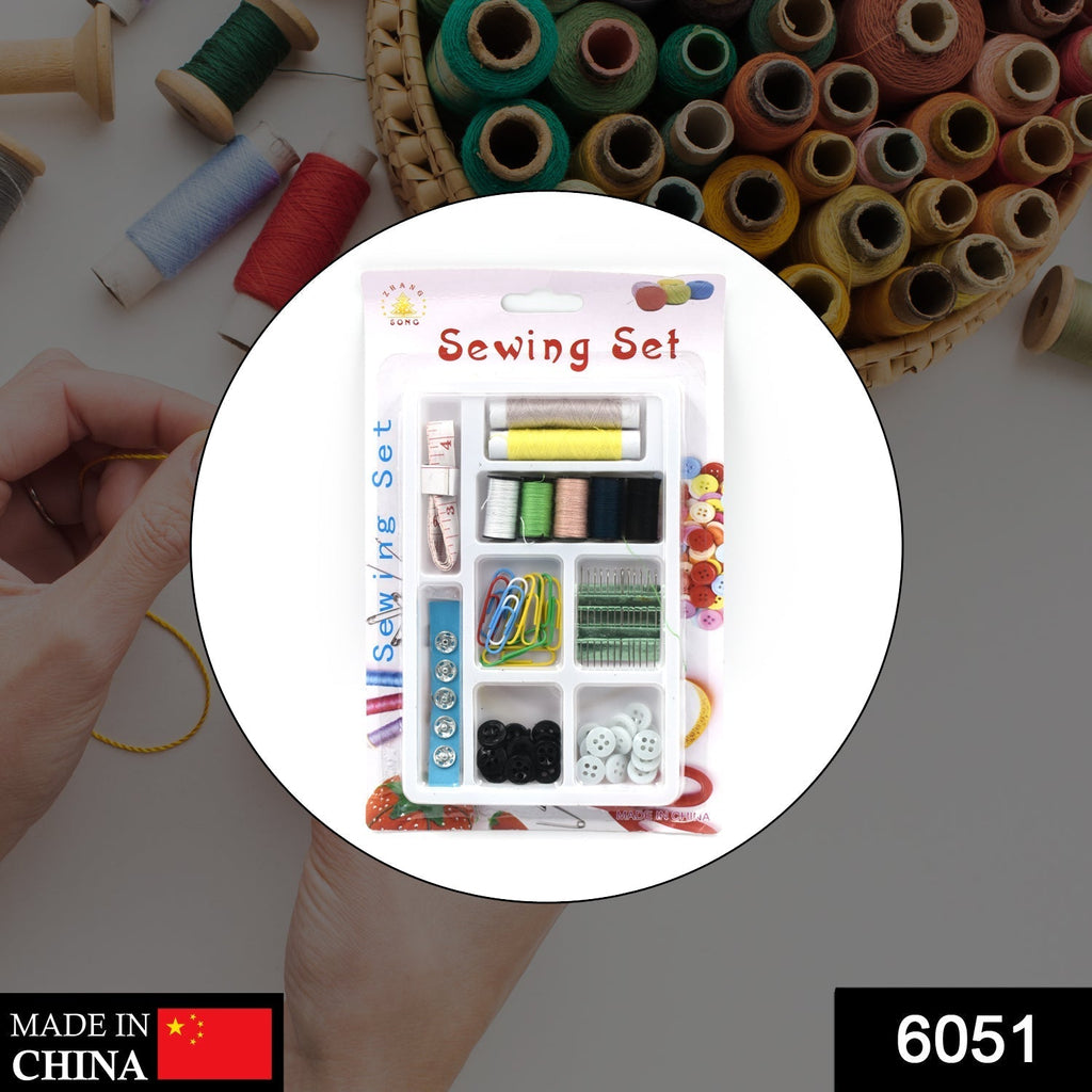 Open 62-piece sewing kit showcasing various needles, buttons, and measuring tape.