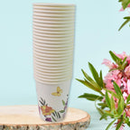 Group of disposable paper cups with a focus on their unique designs.
