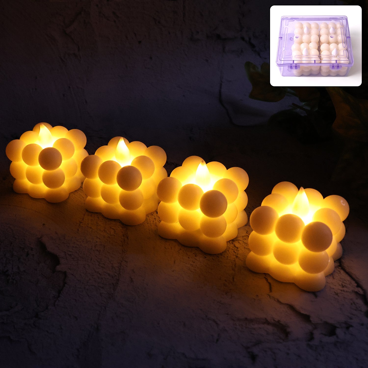 Set of four LED bubble flameless candles with warm glow
