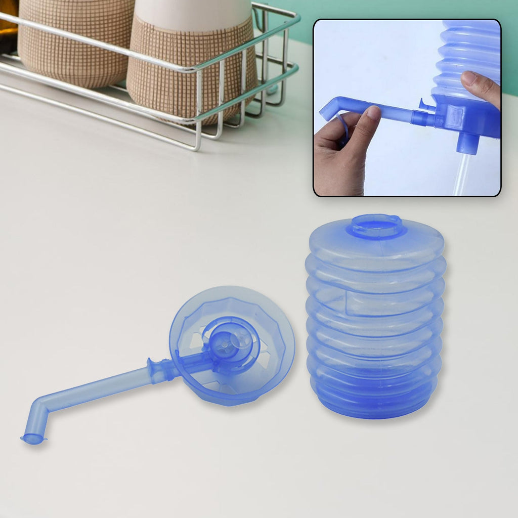 White manual drinking water pump with nozzle, ready for use.
