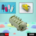 A vibrant red Pig Shape Ice Mold with four cavities, filled with colorful fruit juice for freezing.