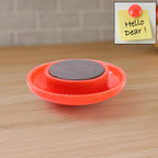 Red magnetic board button measuring 30mm diameter on whiteboard