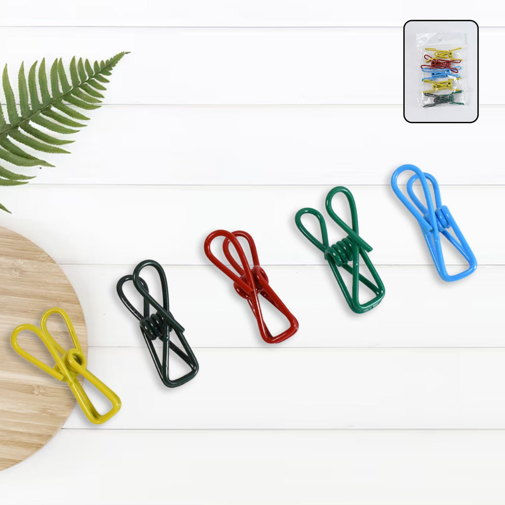 Metal clothes clips holding clothes on an outdoor line during windy weather