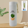 Leakproof 450ml glass water bottle with a natural bamboo lid and silicone sleeve for grip, shown on a clean surface.