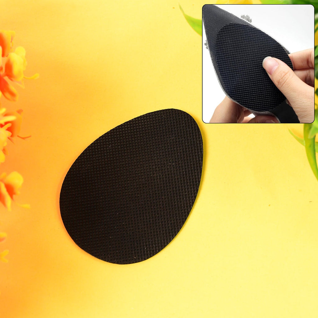 Anti-slip grip sticker applied on shoe sole for enhanced traction