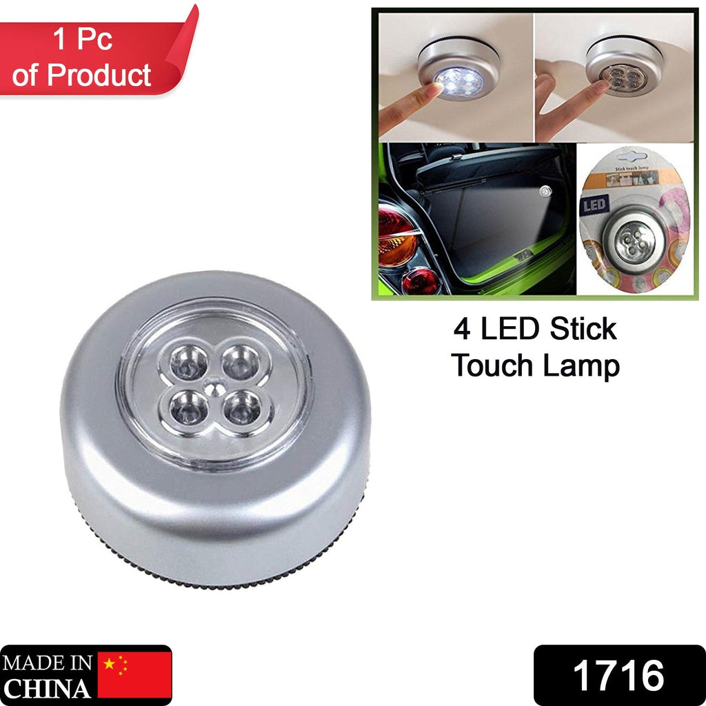Wireless touch lamp illuminating kitchen cabinets for convenience.