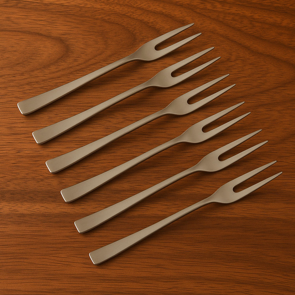 Ergonomic design close-up of stainless steel multi-prong fruit fork