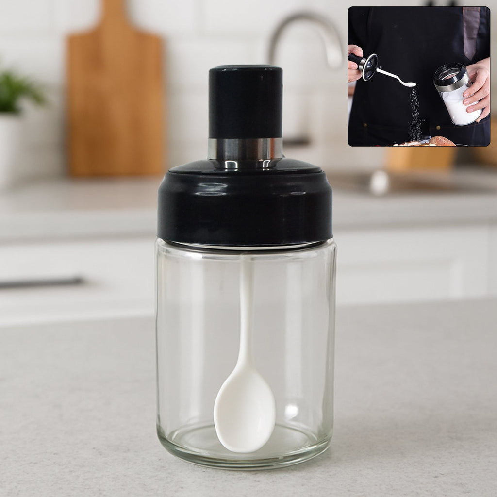 Transparent glass storage jar with built-in spoon, perfect for kitchen use
