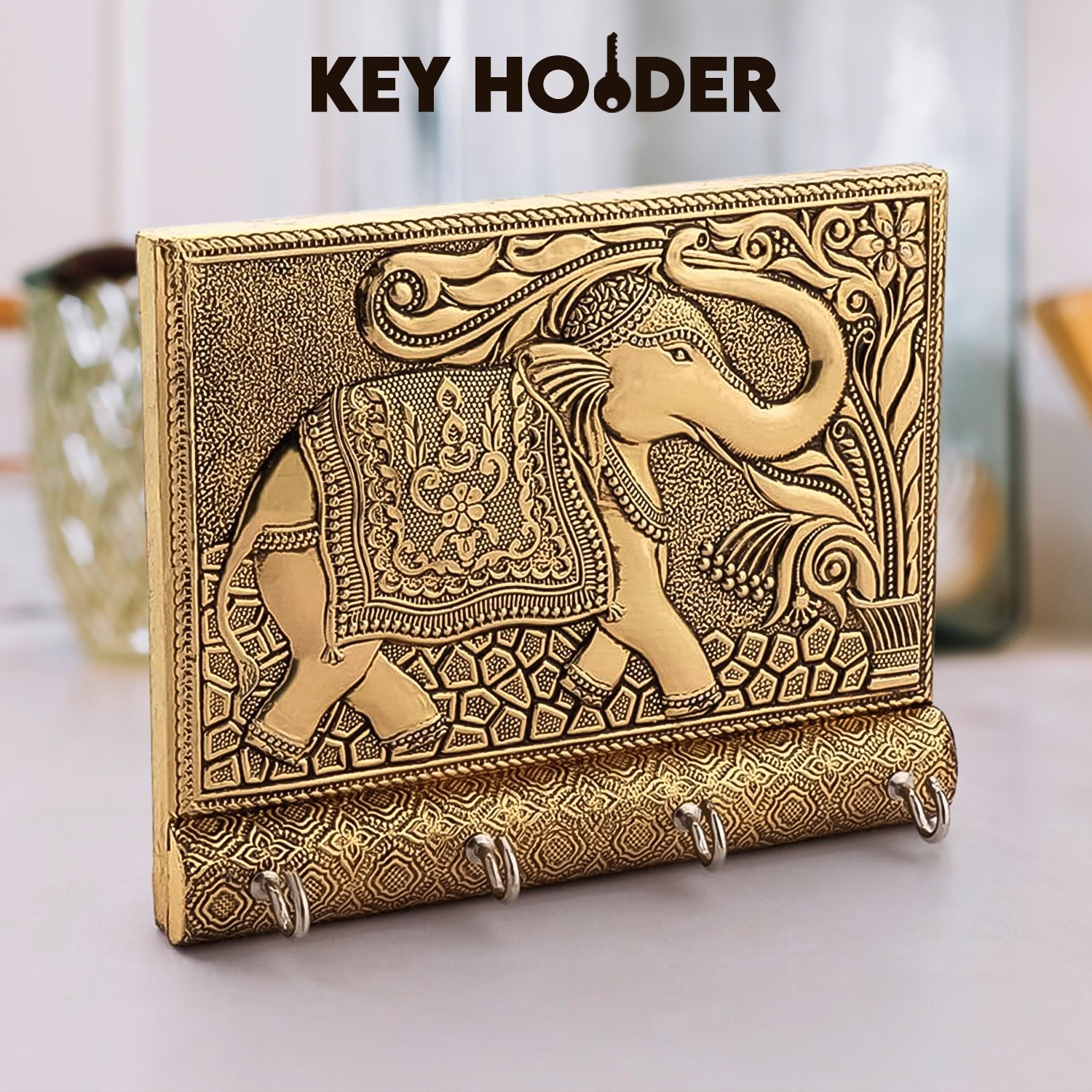 Elegant wooden elephant key holder mounted on a wall.