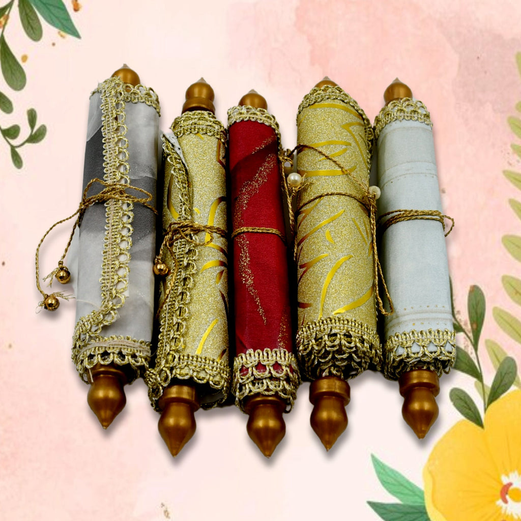 Single rolled multi-color designer lifafa, showcasing its compact form.
