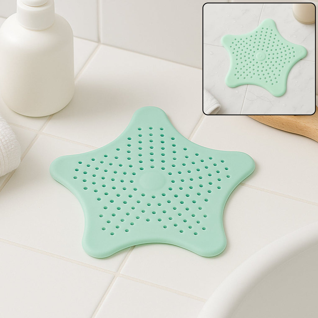 Mint green silicone star shaped sink strainer placed on bathroom sink drain