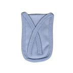 Close-up of the natural cotton fabric texture of the reusable tap filter.