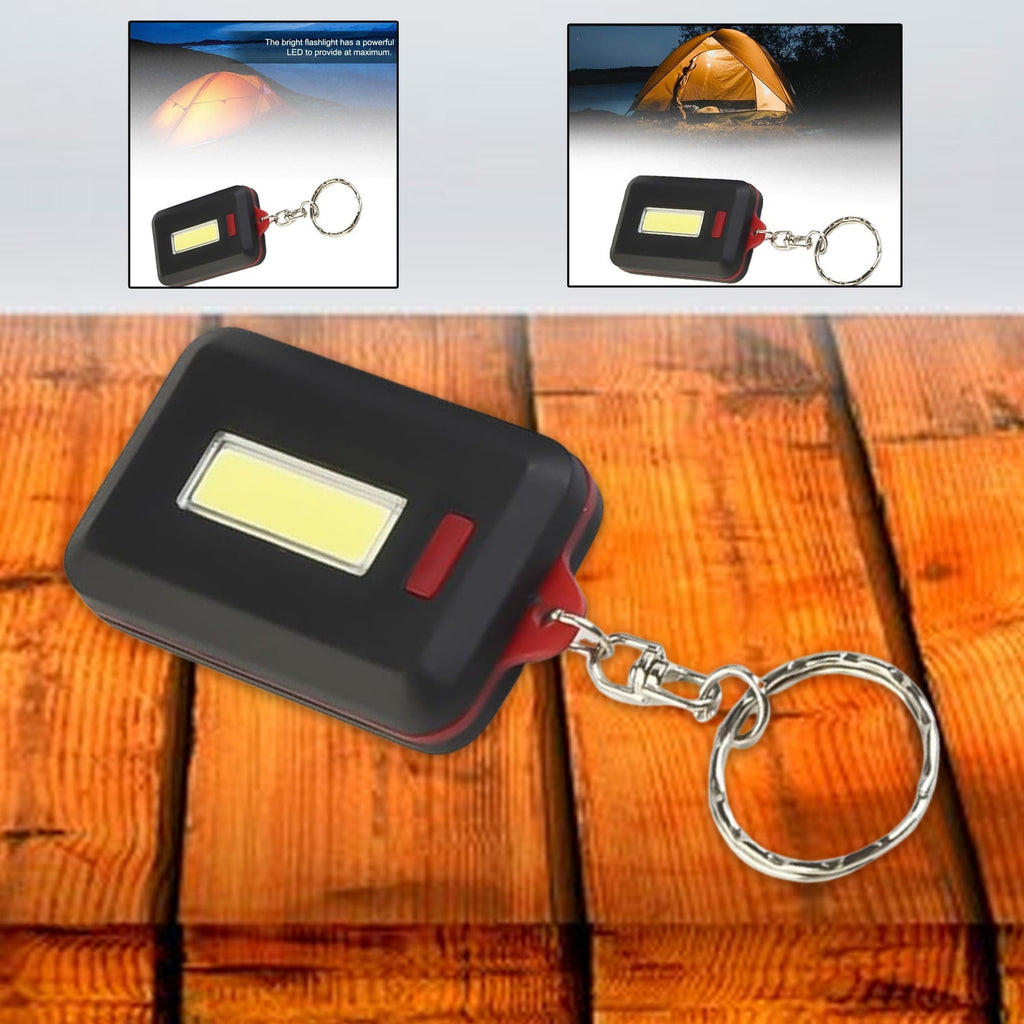 Compact LED keychain light with hook and loop sticker attached