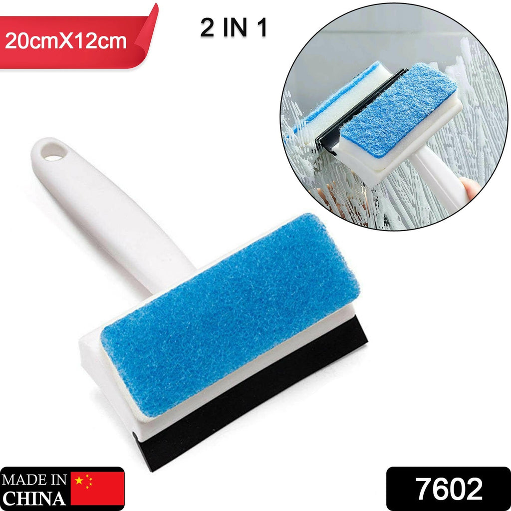 The double-sided cleaning brush tackling a dirty bathroom mirror with ease.