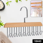 Multi-hook wooden hanger from Organivo neatly organizing various belts and ties.