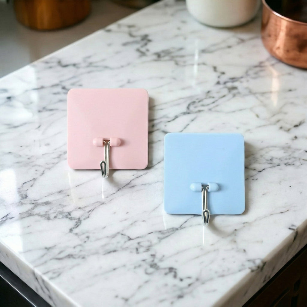 Self-adhesive wall utility hook with square base mounted on wall