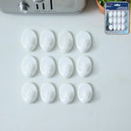 Self adhesive wall hook holding keys securely on a tiled wall