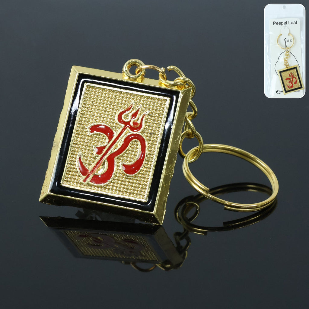 Golden metal Om Trishul keychain front view showcasing intricate spiritual design