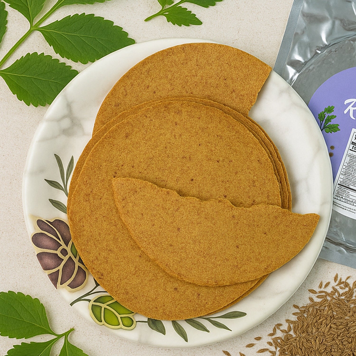 Pack of Maniarr's Carmonised Ragi Khakhra (180g) showing crispy texture.