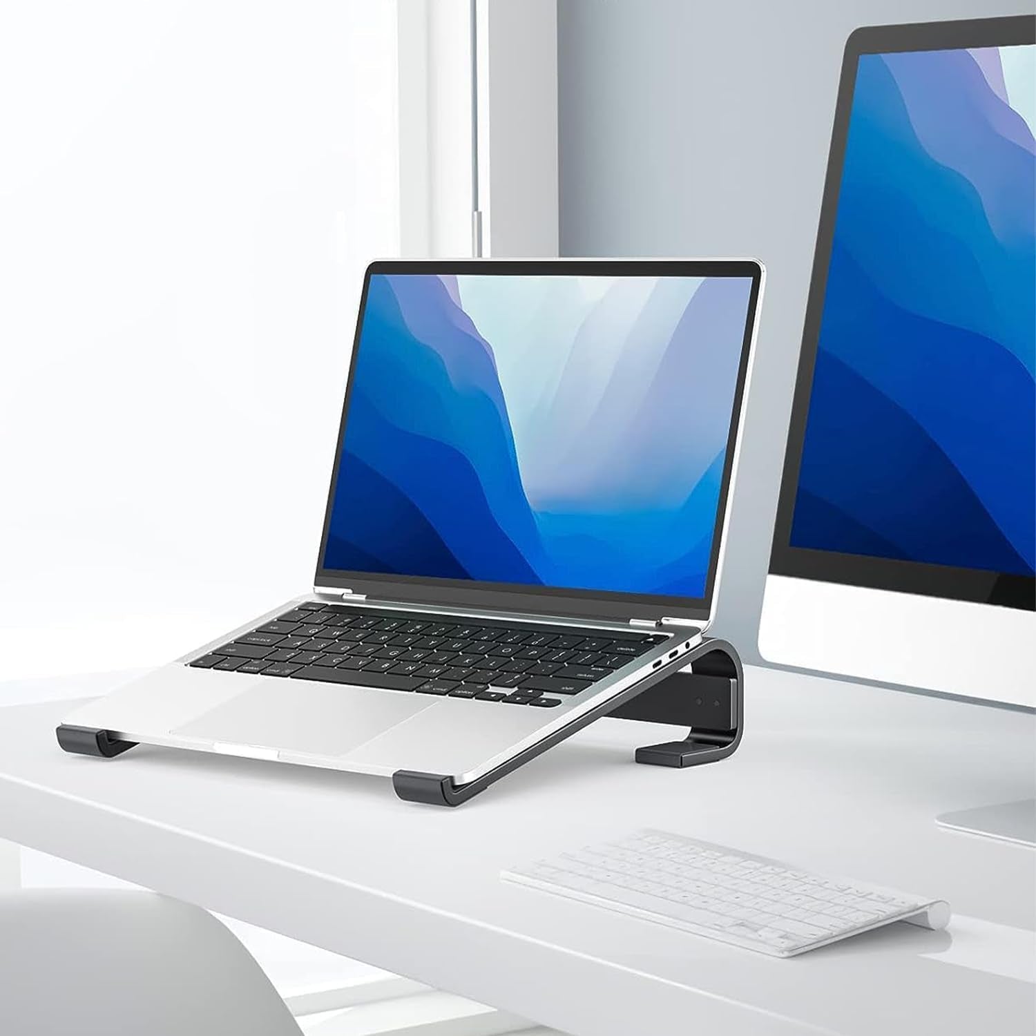 Fixed metal laptop stand offering ergonomic desk support