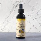 Beeswax Furniture Polish spray bottle highlighting natural ingredients for wood and leather care.
