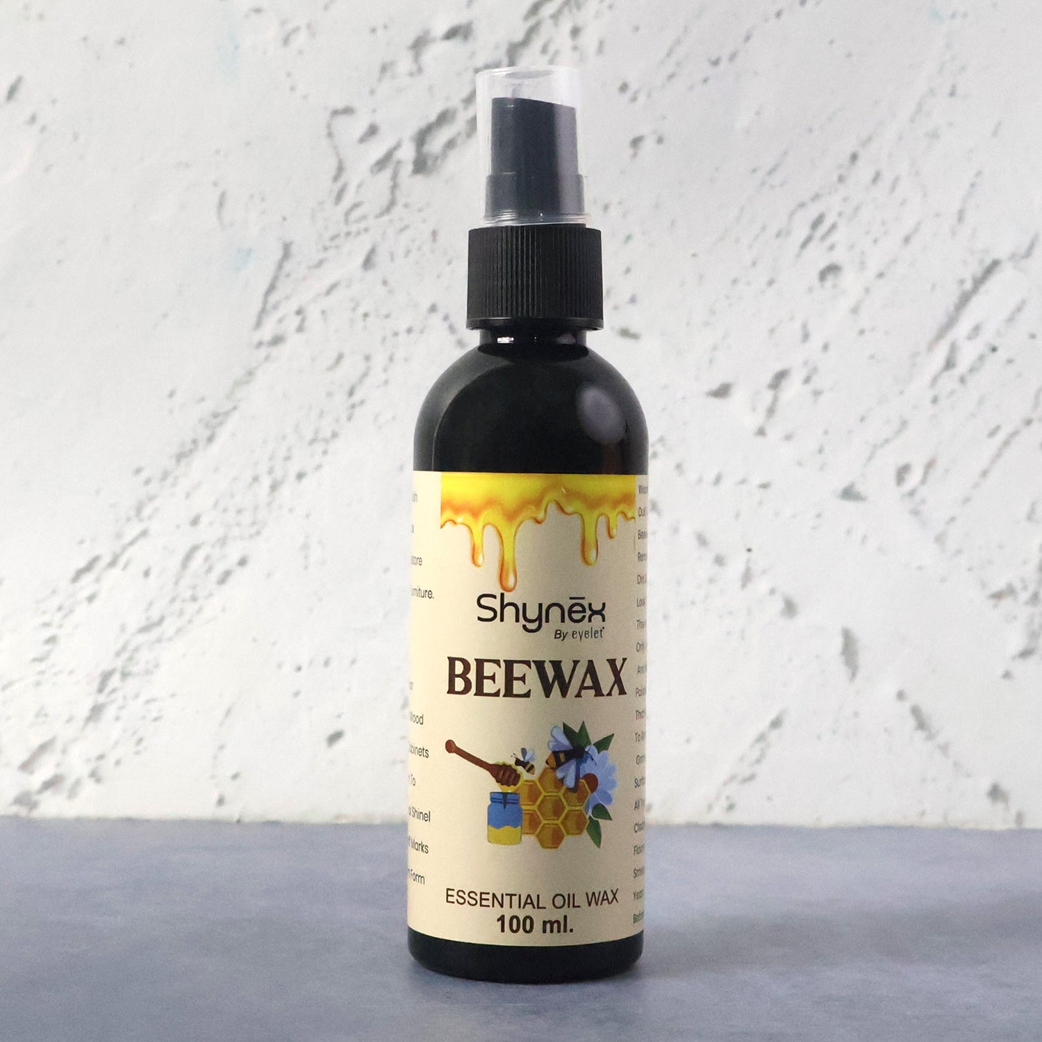 Beeswax Furniture Polish spray bottle highlighting natural ingredients for wood and leather care.