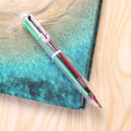 Multicolor Ball Pen showcasing 6 vibrant ink colors for creative writing tasks.