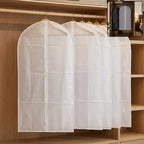 Main view of foldable non-woven suit cover set showing full-length zipper and breathable fabric.