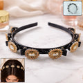 Gold stone studded hairband with luxurious design