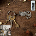 Metal Krishna face keychain with detailed Lord Krishna design