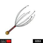 Ergonomic handheld scalp massager with resin tips for stress relief and relaxation.