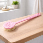 Side view of a pink long handle bath brush, ideal for hard-to-reach areas during shower.