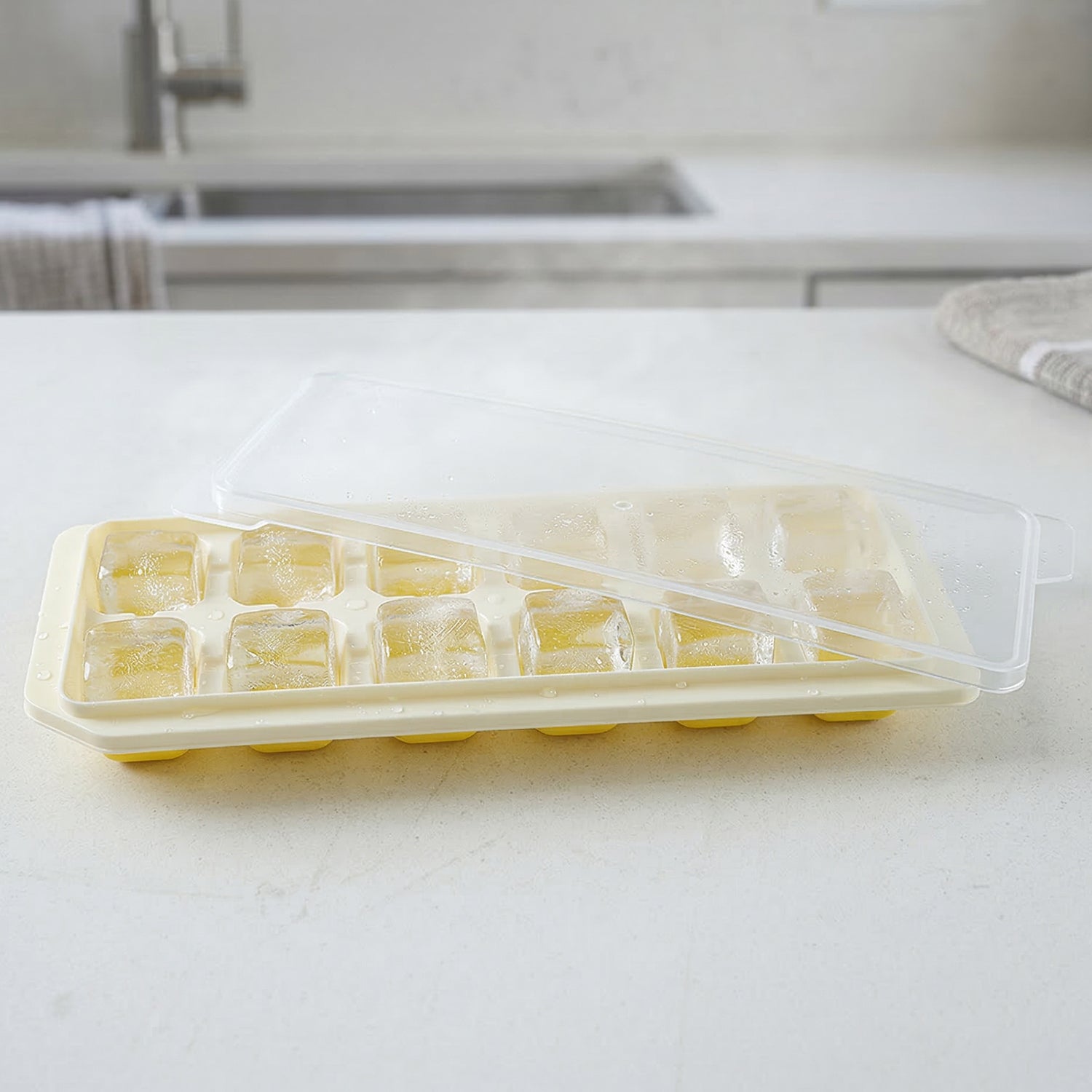 Ice cube tray with lid, perfect for making frozen treats and storing in freezer.