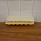 Easy release silicone ice cube maker with 24 compartments and lid.