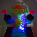 Side view of the transparent gear robot car showcasing its vibrant internal gears and robust design.
