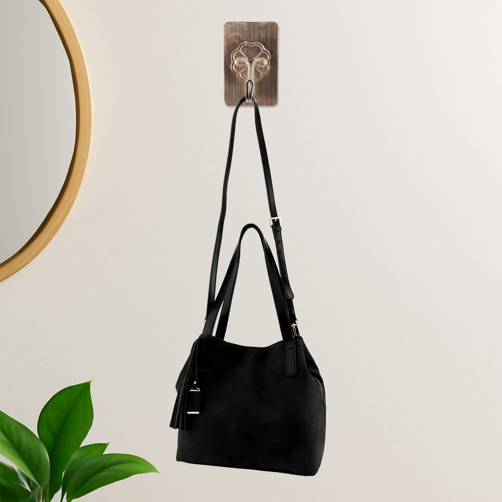 Clear self-adhesive wall hook for compact storage