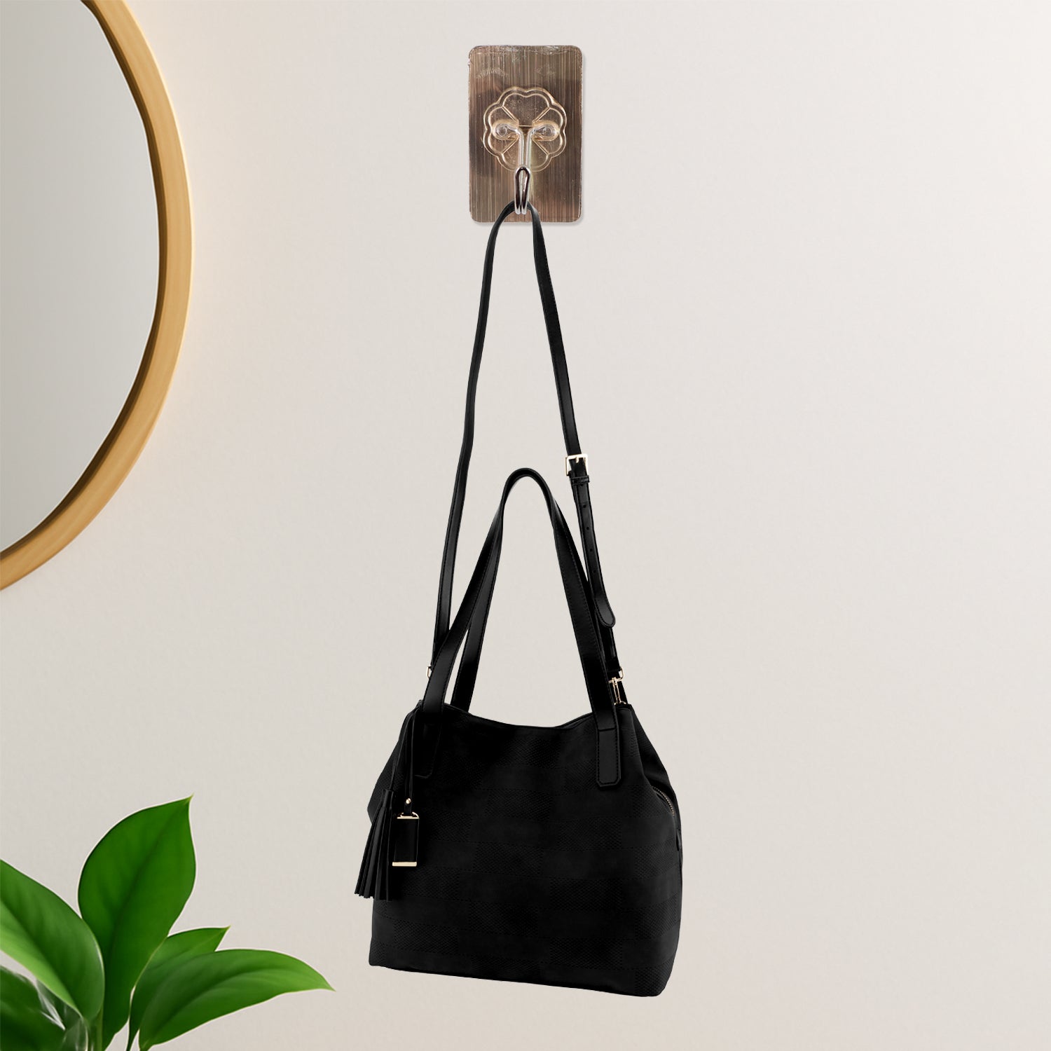 Clear self-adhesive wall hook for compact storage