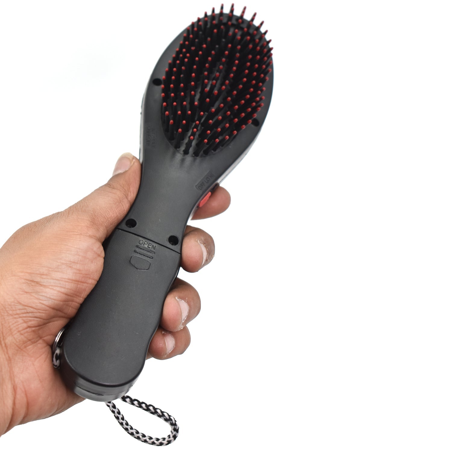 Black electric hair massager comb with bristles for scalp stimulation.